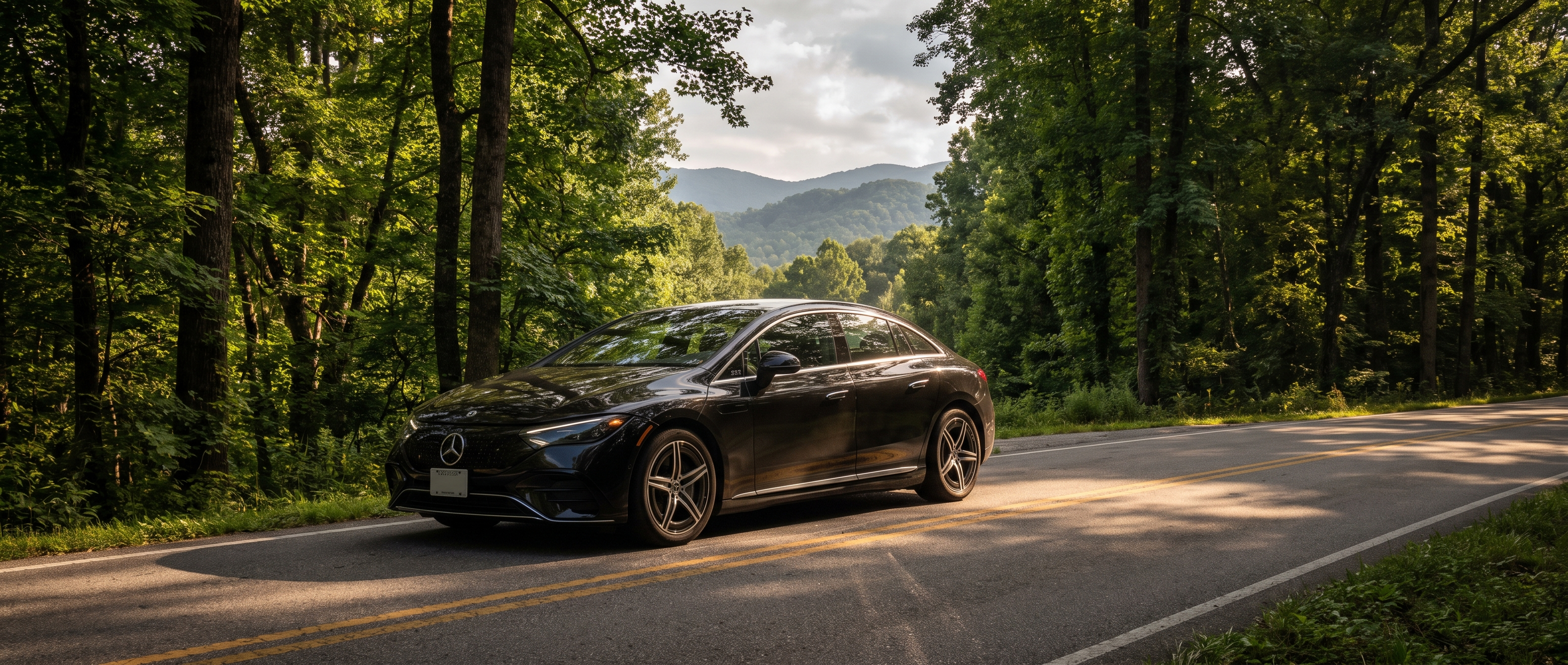 2026 Mercedes-Benz EQE sedan on a North Georgia mountain highway heading toward Blue Ridge